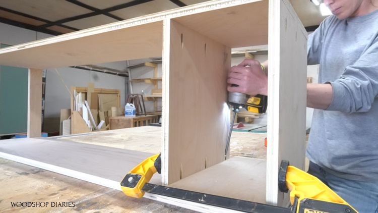 Installing middle shelf into tall pantry cabinet with pocket hole screws