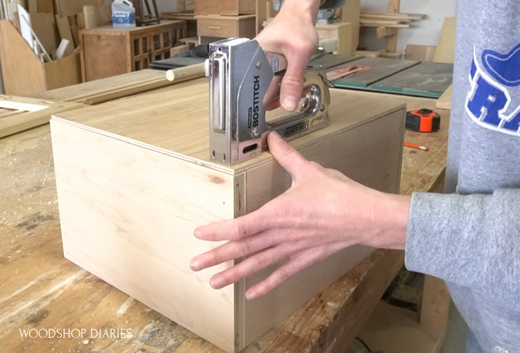 using staple gun to install ¼" plywood drawer bottom into drawer box