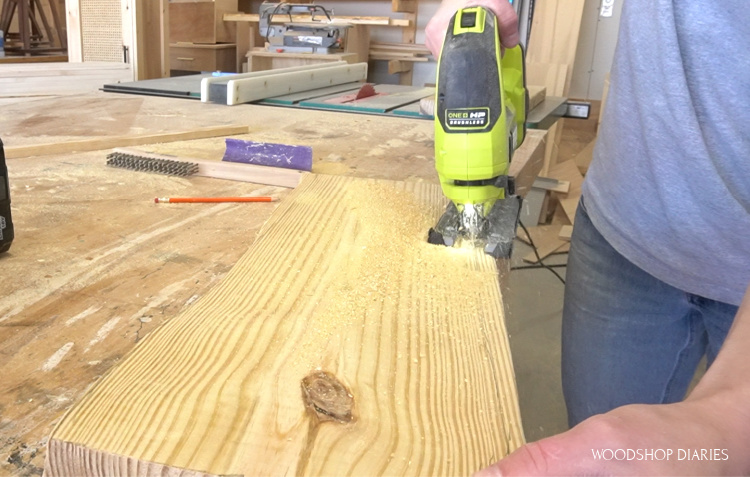 Shara Woodshop Diaries using Ryobi jig saw to cut a fake live edge onto 2x10 board