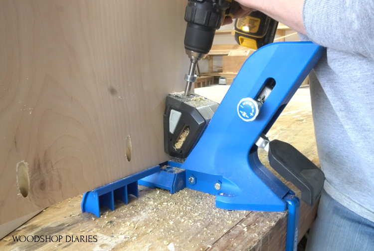 Using a drill to drill pocket holes into plywood panel with Kreg 720