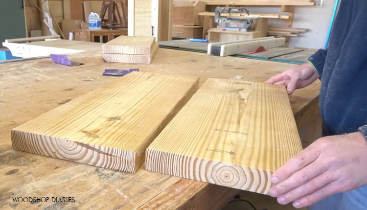 two pieces of 2x10 board laid on workbench to make one shelf