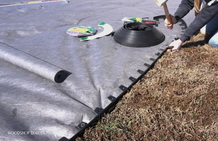 Securing no dig edging to outline backyard makeover space