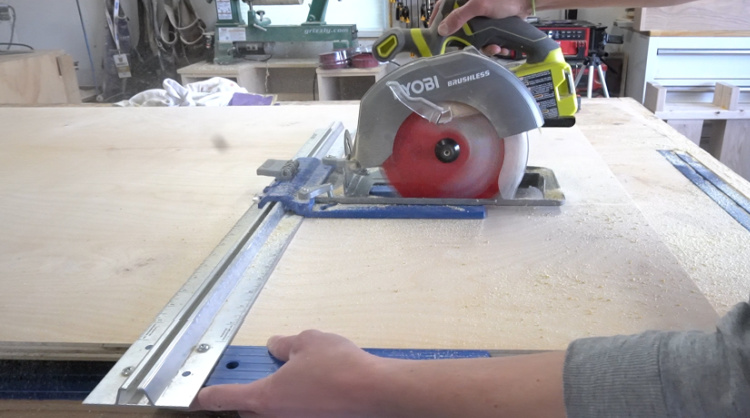 Using a circular saw and rip cut to cut a plywood sheet