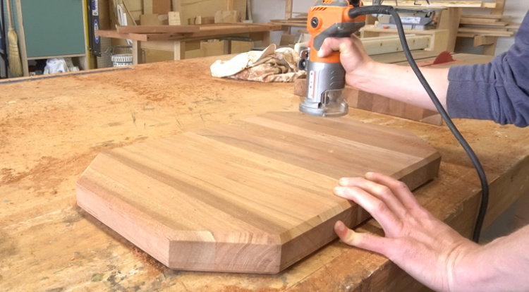 Routing a chamfer edge along cutting board corners