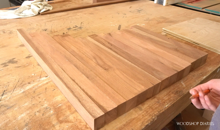 Door pieces laid out on workbench longest to shortest to determine best size of cutting board