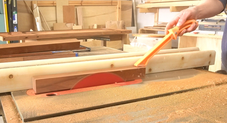 Running pieces through table saw to remove veneer layer