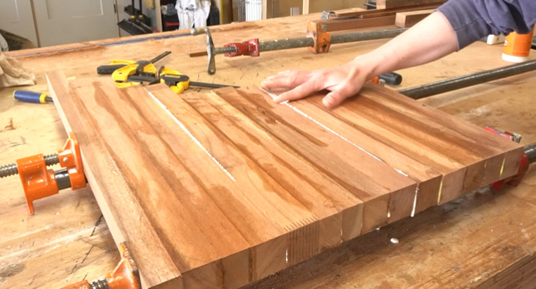 Gluing up multiple sections of cutting board in pipe clamps