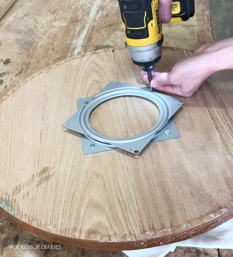 Upside down resin circle attaching lazy susan hardware on bottom