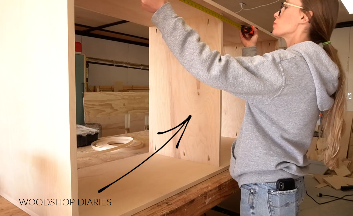 Shara Woodshop Diaries installing middle divider panel into modern dresser box