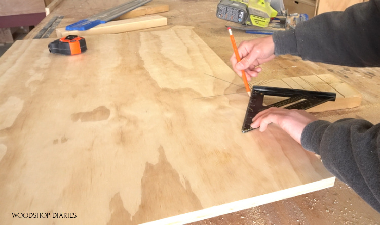 Using a speed square to mark 60 degrees for roof peak of DIY pet house front panel