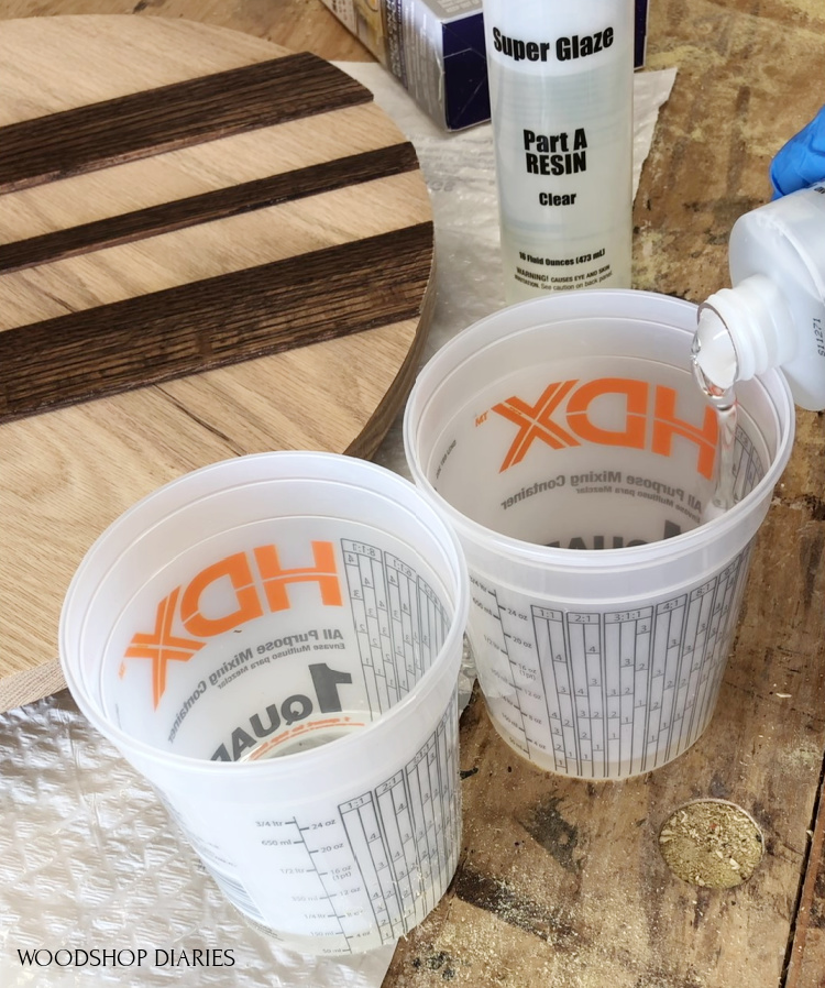 measuring out superglaze epoxy into separate cups