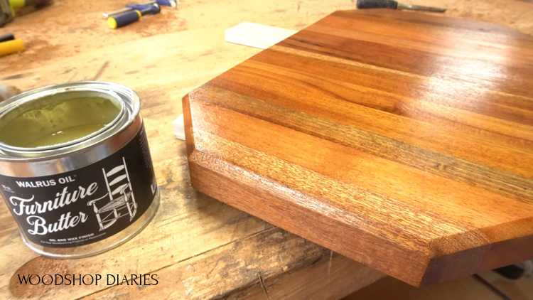 Applying Walrus Oil Furniture Butter to cutting board