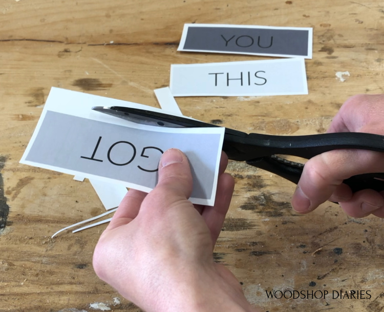 Shara Woodshop Diaries cutting paper to frame onto plexiglass