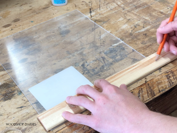 Marking where to cut shim to fit around plexiglass sheet