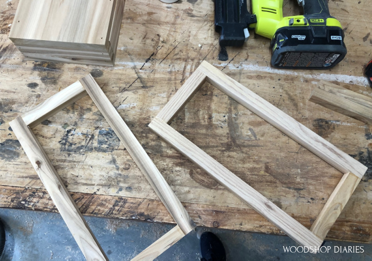 Two rectangle frames assembled on workbench to make lantern top from