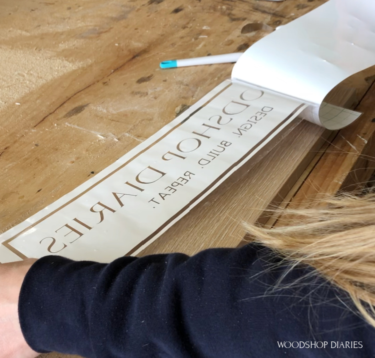 Removing back from vinyl stencil to add lettering to DIY wooden sign