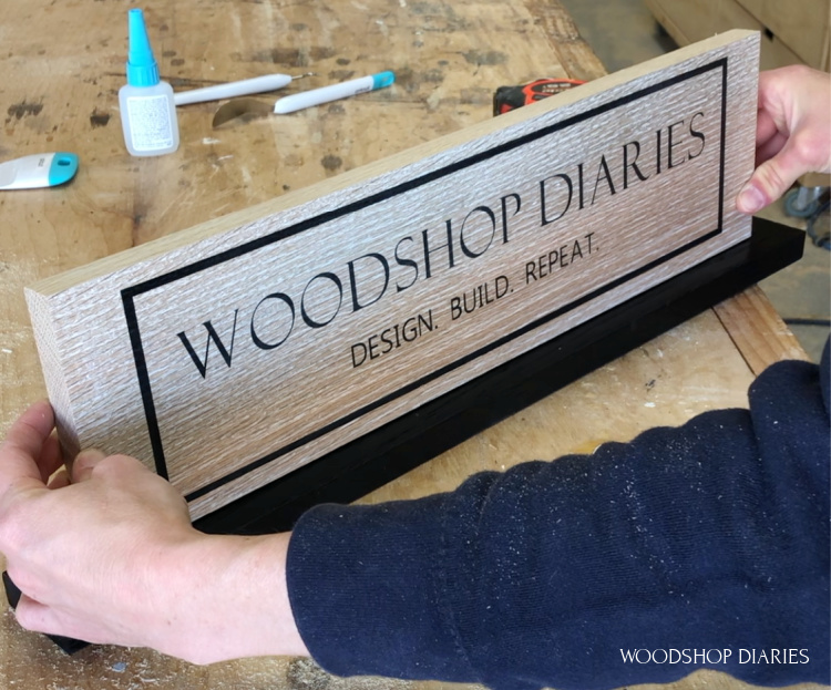 Gluing vertical custom wooden sign onto base plate to stand on its own