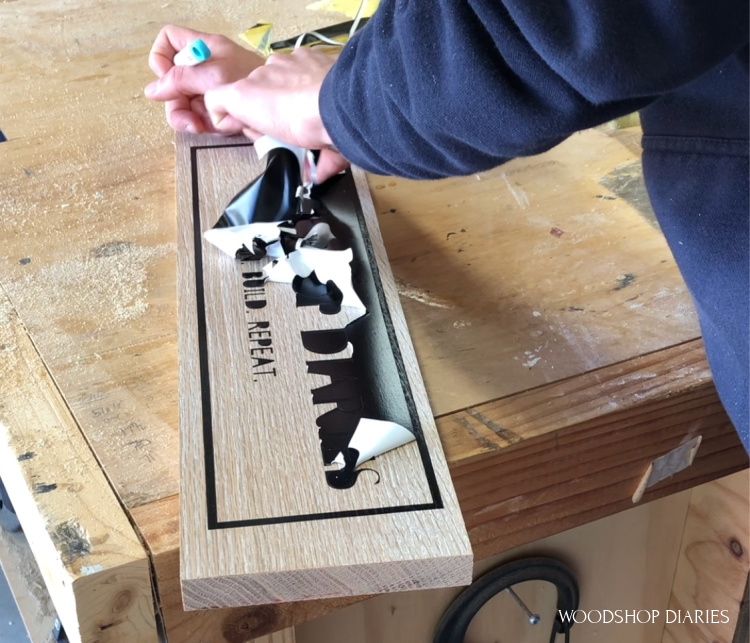 Removing vinyl stencil from wooden sign