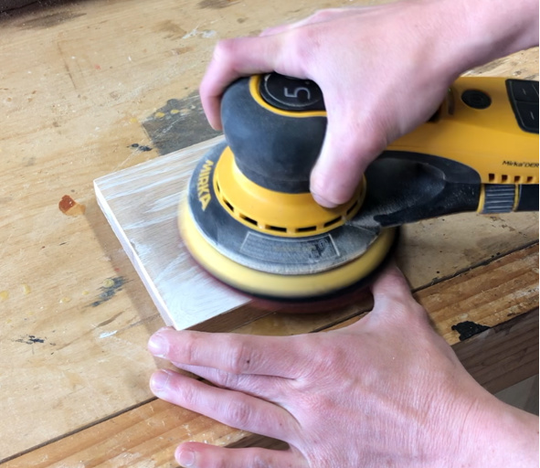 orbital sander sanding wood grain filler down smooth