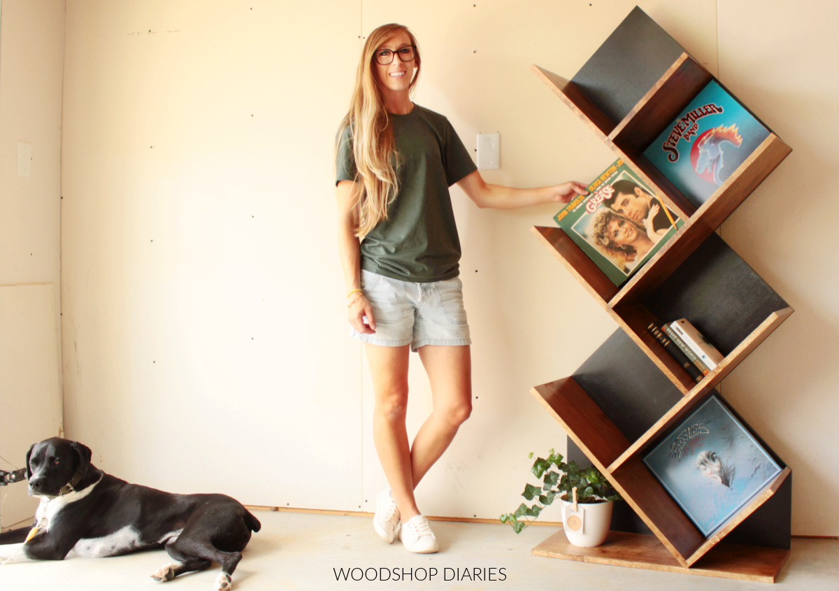 Shara Woodshop Diaries standing next to DIY vinyl record shelf after it was complete