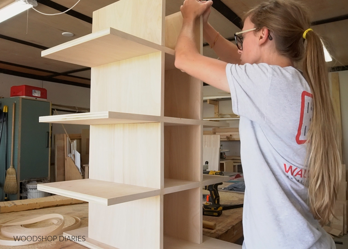 Shara Woodshop Diaries aligning shoe cubby pieces for gluing in workshop