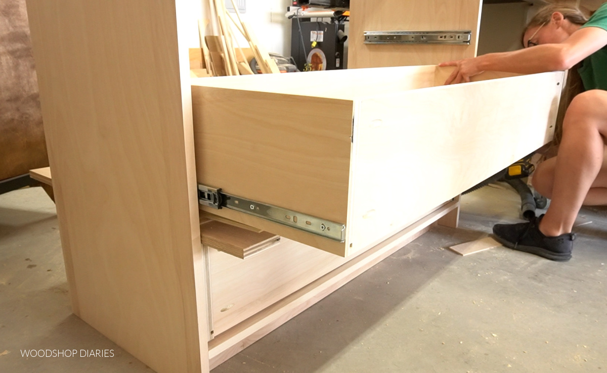 Shara Woodshop Diaries installing drawer boxes onto drawer slides with spacer blocks