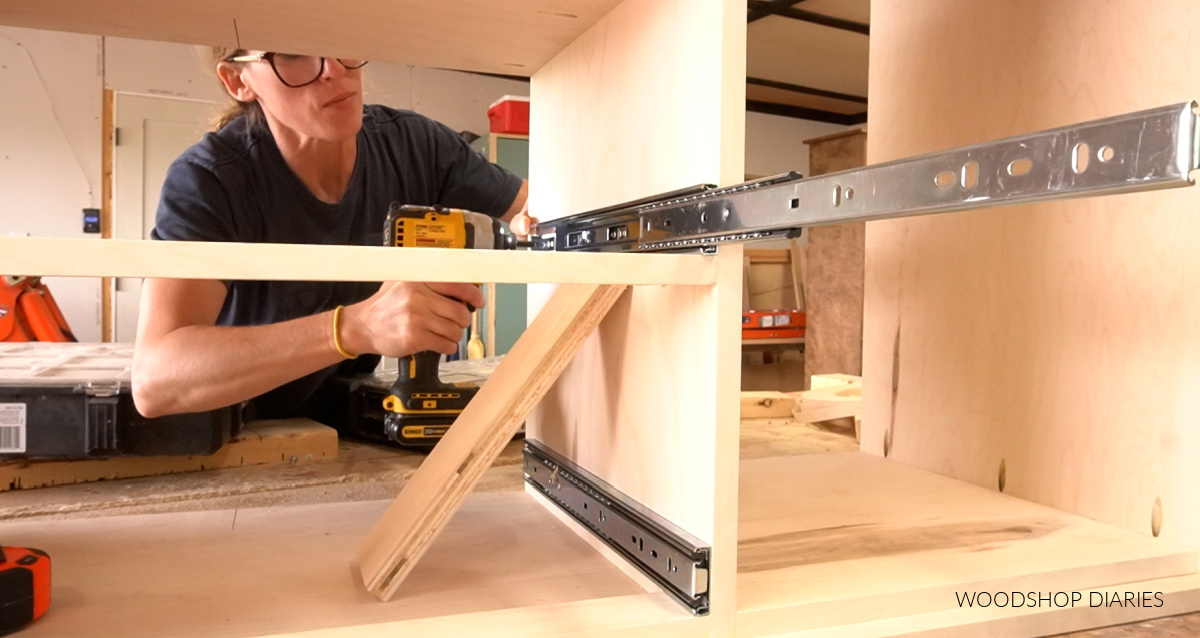 Shara Woodshop Diaries installing drawer slides onto cabinet of dresser body