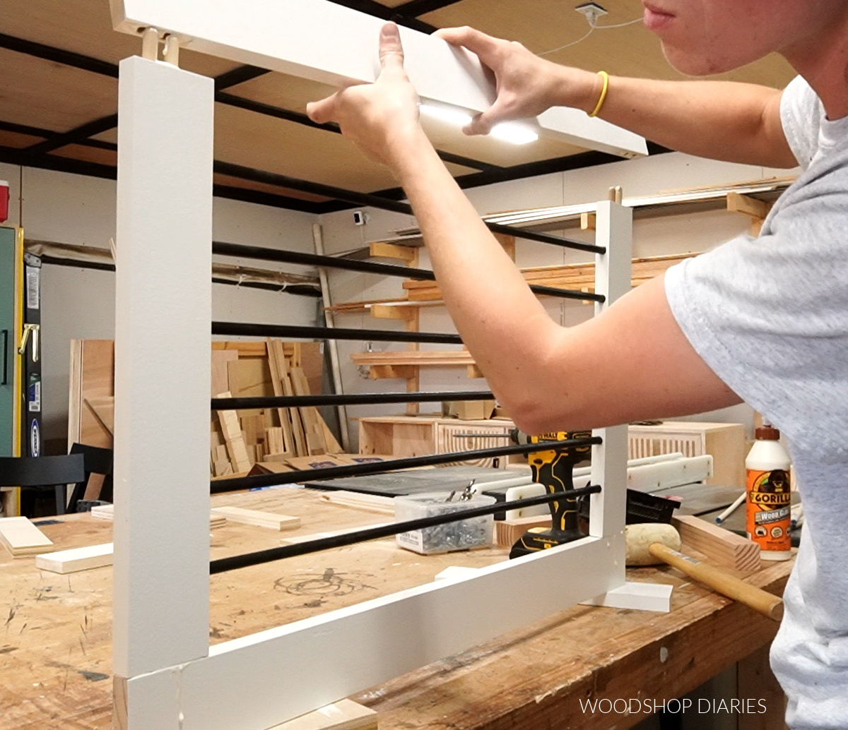 Assembling door frame panel of dog crate using dowels and glue