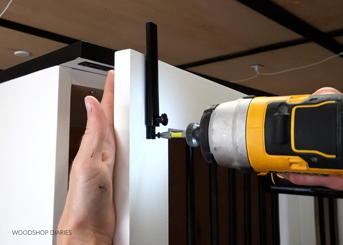 Close up of installing surface bolt latch onto dog crate door