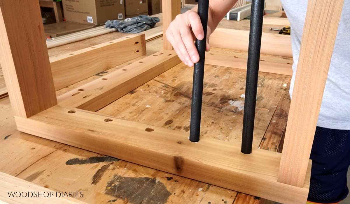 Installing dowels as chair rails into the arm rests