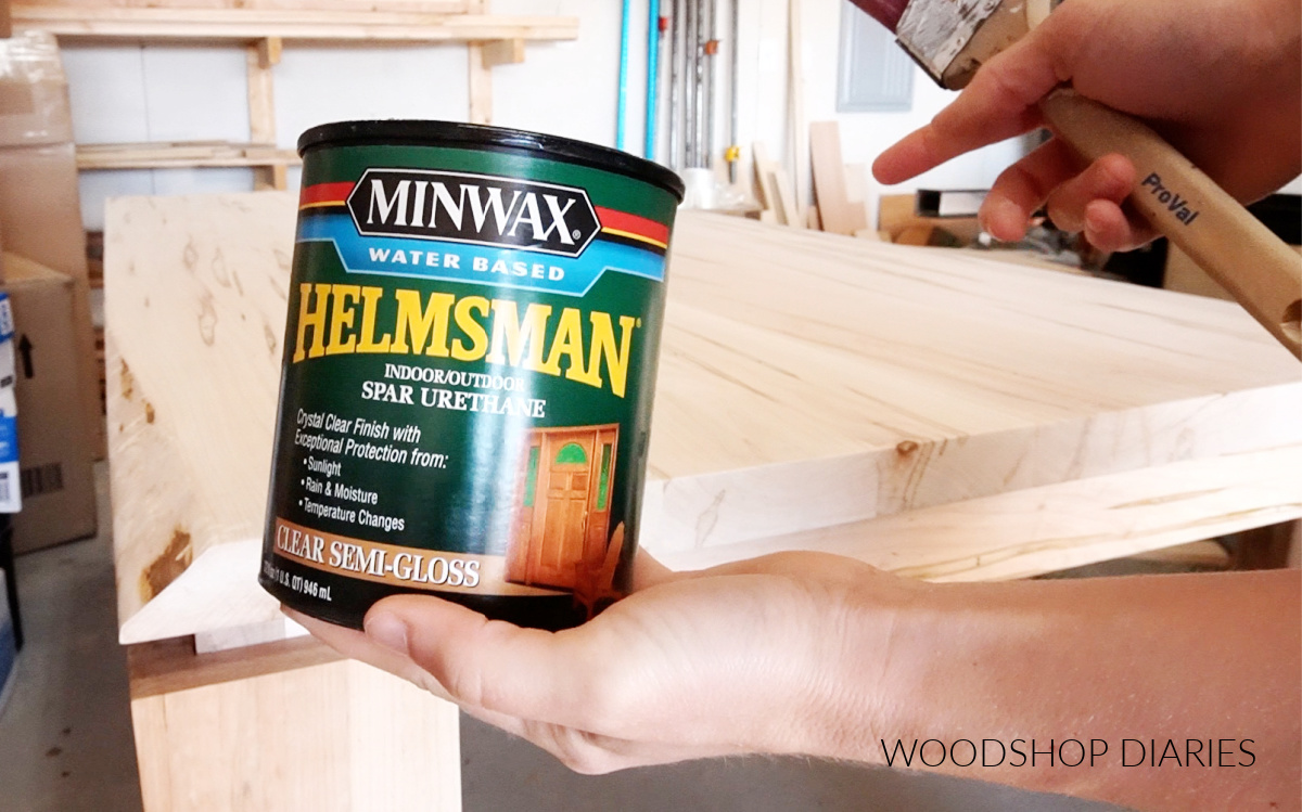 Minwax Helmsman water based finish can in front of unfinished maple dining table