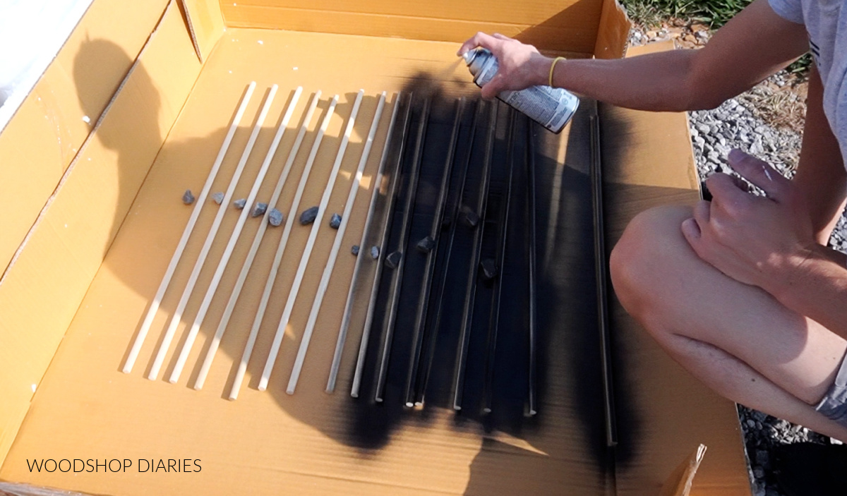 Spray painting dowel rails for dog crate panels