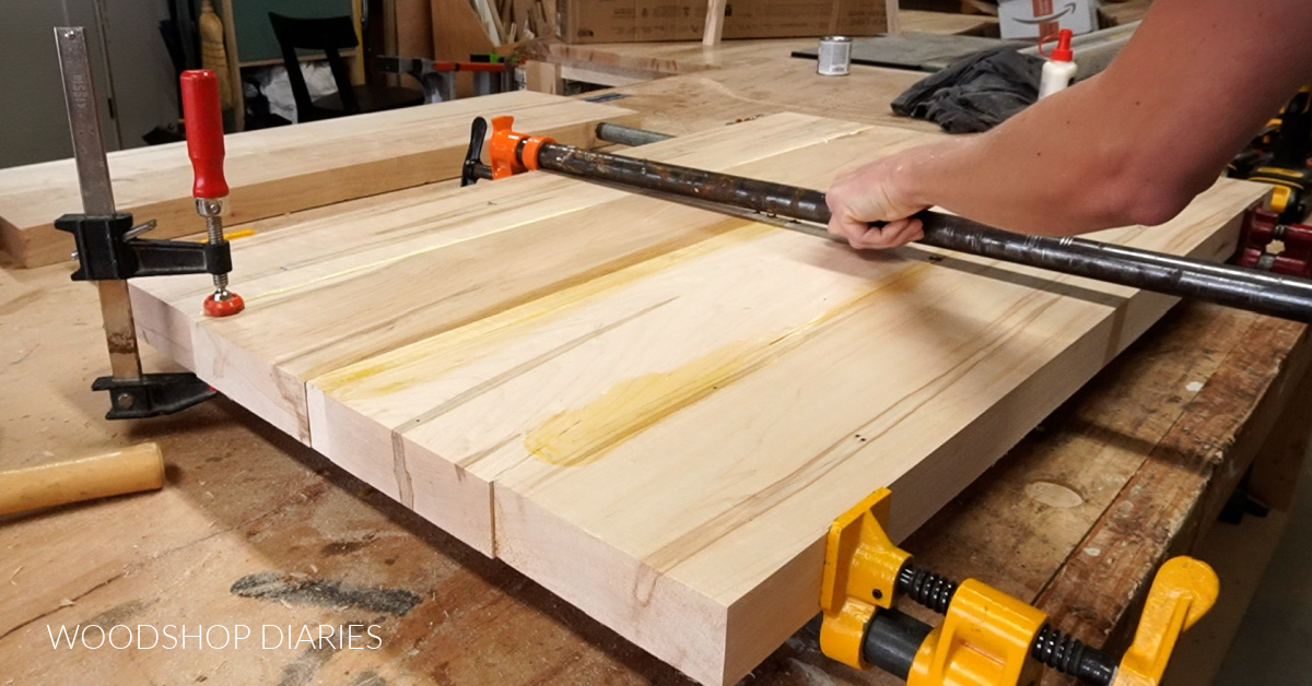 Using pipe clamps to glue and clamp table top panel together
