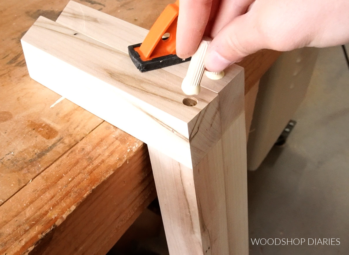 Close up of plugging screw holes in coffee table legs