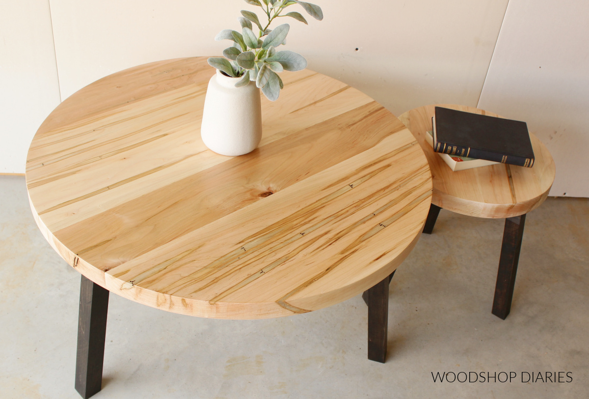 Overhead view of round wooden coffee tables--one large and one small side by side