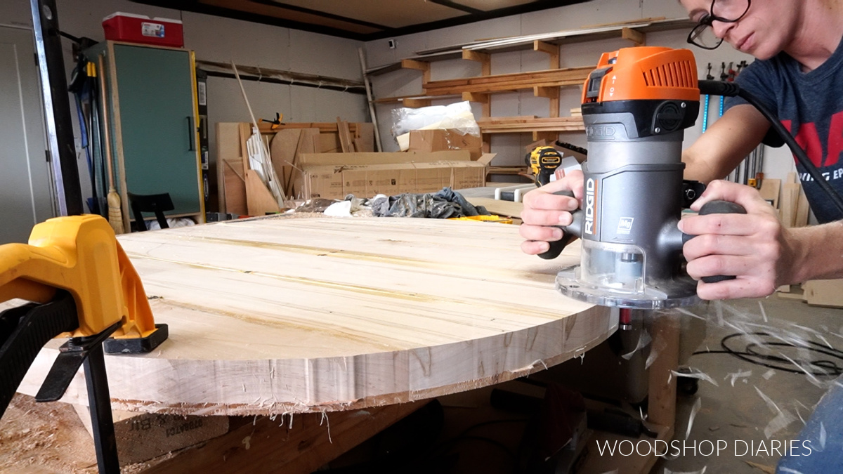 Router and flush trim bit smoothing out coffee table top edges