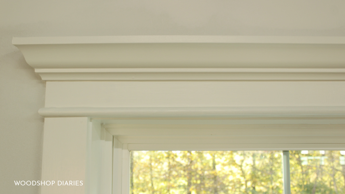 Close up image of window trim with crown molding and half round