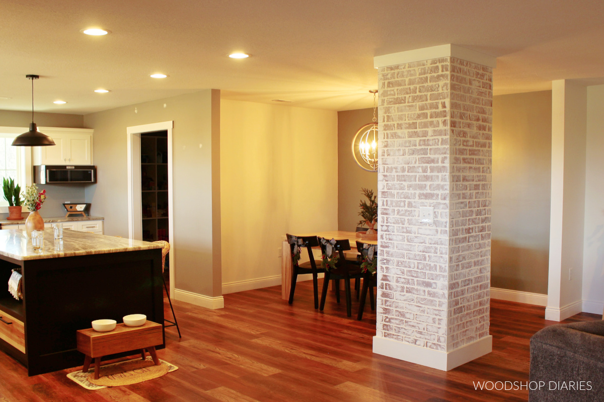 View of faux bricked column from front door showing kitchen and dining room in background