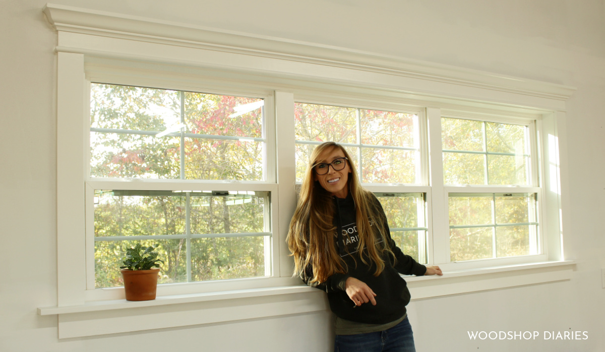 Shara Woodshop Diaries against finished window trimmed out with basic wood and crown molding