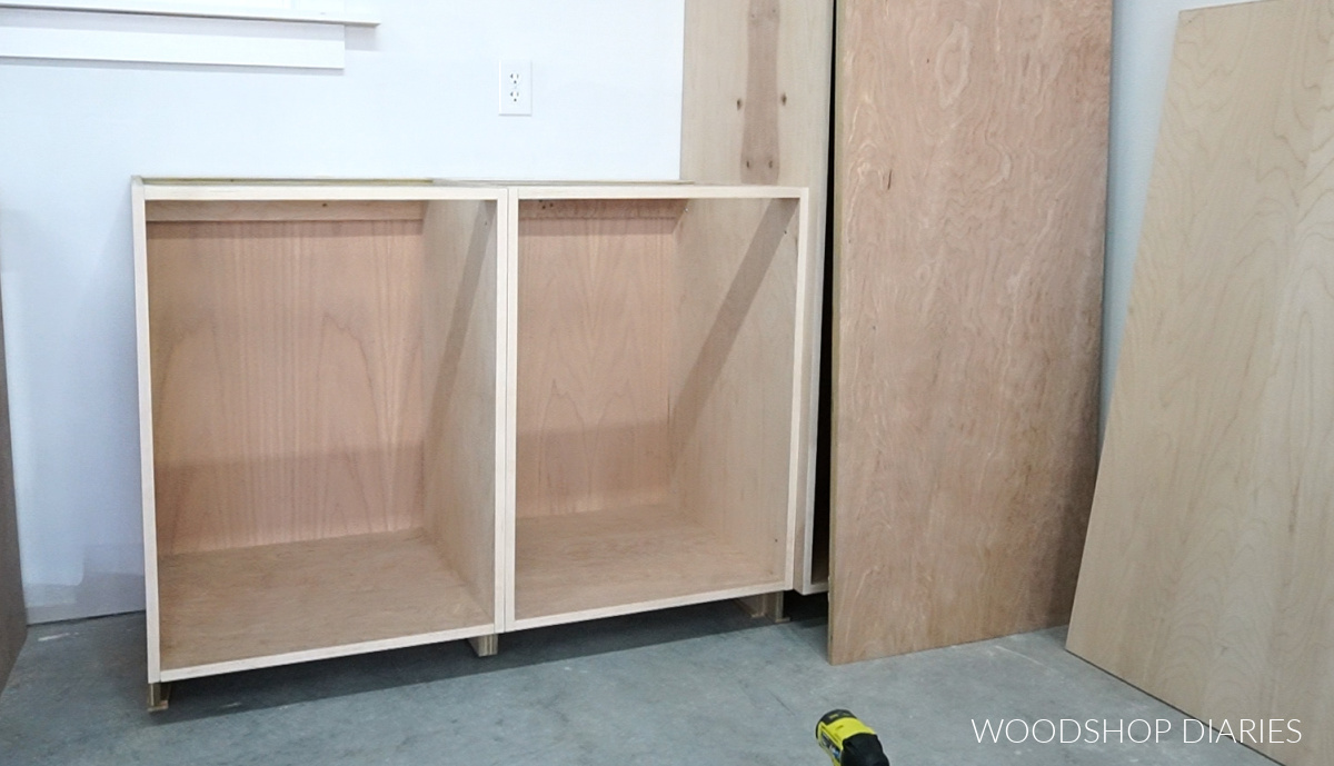 Frameless workshop cabinets being installed