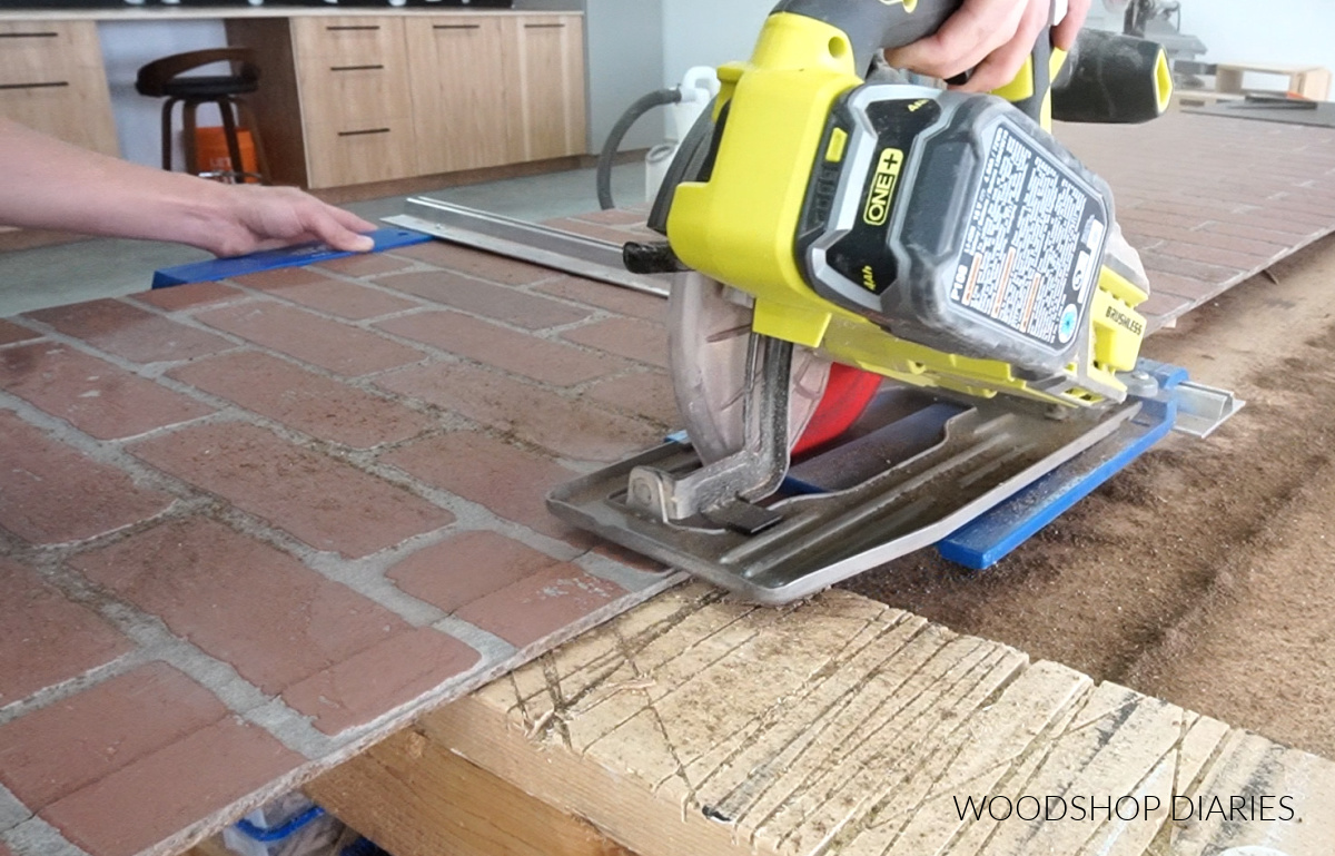 Shara Woodshop Diaries using circular saw to trim strip off edge of brick paneling sheet