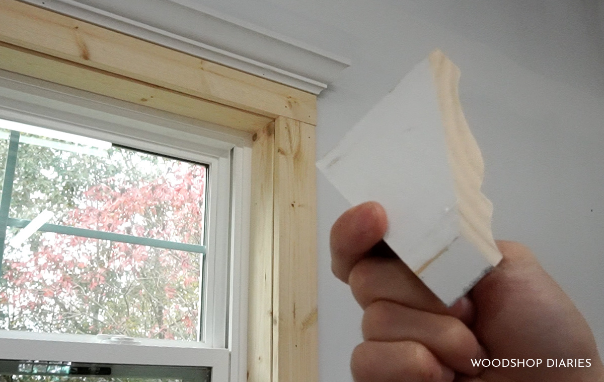 Close up of end caps of crown molding to be added to window trim