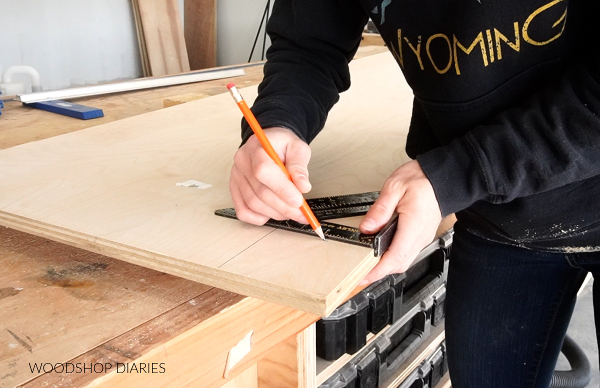 Shara Woodshop Diaries marking out toe kick locations on pantry cabinet sides