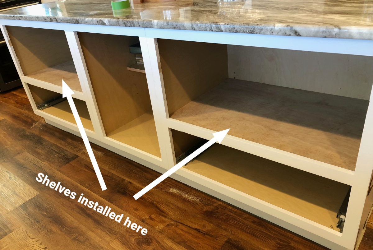 Plywood shelves installed into kitchen island for open shelving