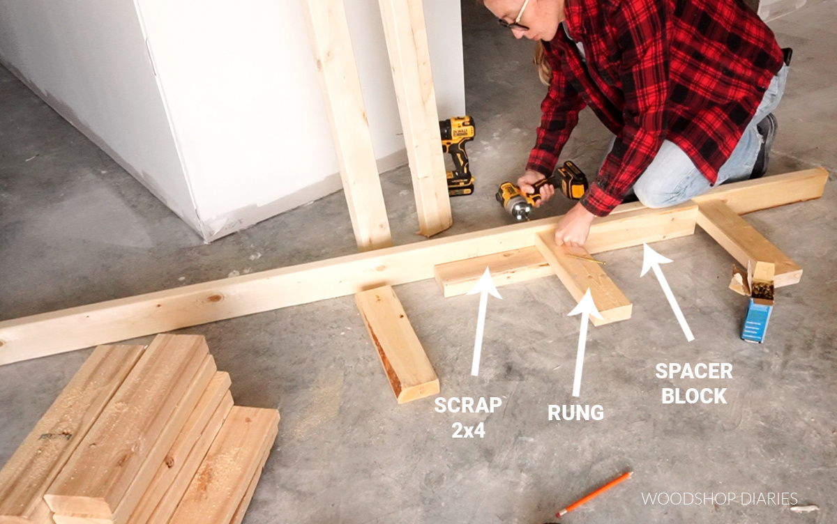 Shara Woodshop Diaries securing rungs to backer board of lumber rack with 4" wood screws