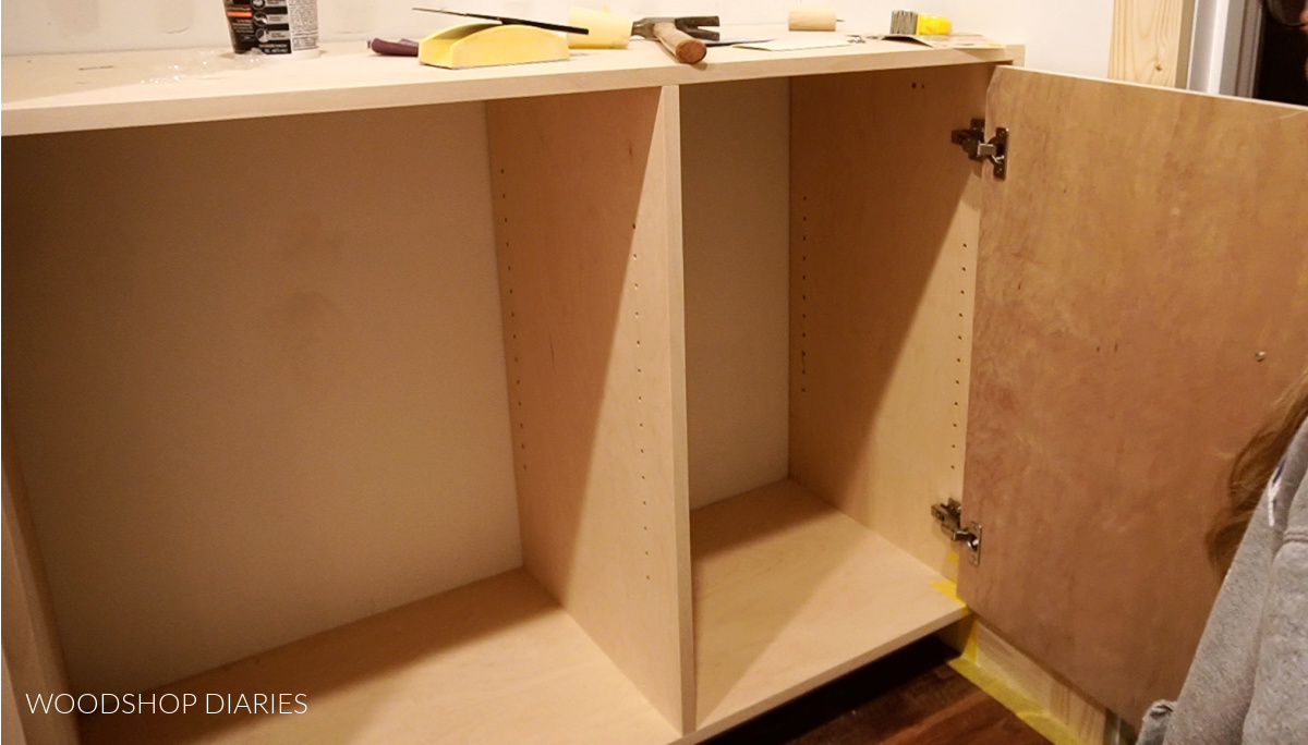 Door installed onto dresser cabinet in closet