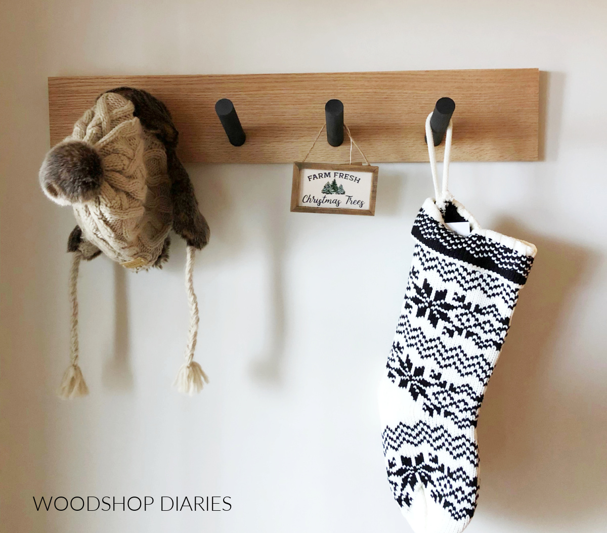Easy scrap wood stocking hanger made with a single board and some dowels