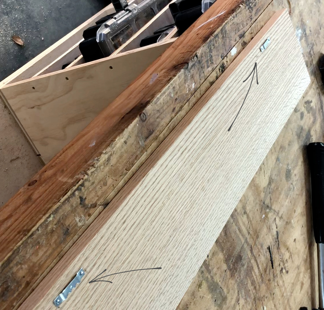 Sawtooth hangers attached to back side of board