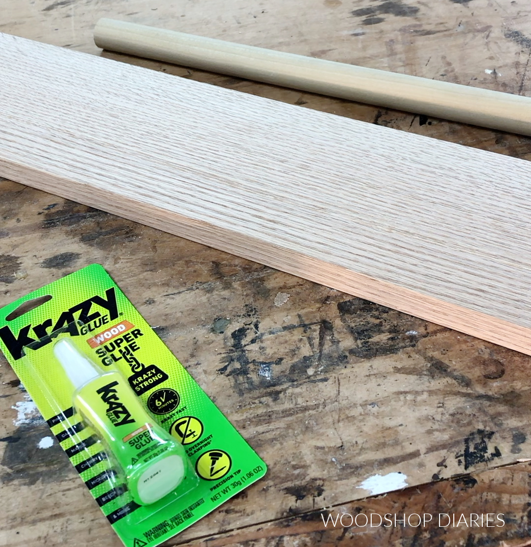 Krazy Glue, board, and dowel supplies to make stocking hanger rack