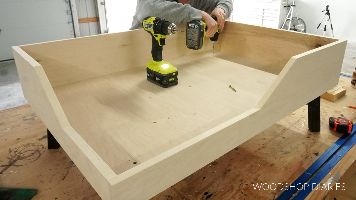 Shara Woodshop Diaries installing plywood box to X base